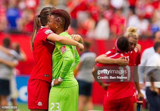 Karina LeBlanc of Canada is consoled after losing to England during the FIFA Women's World Cup Canada 2015 Quarter Final match between England and...