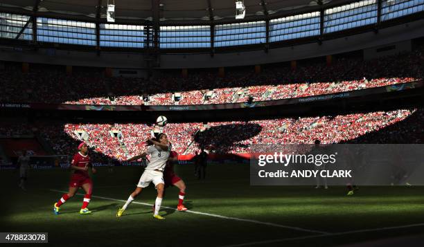 England midfielder Jill Scott and Canada defender Allysha Chapman fight for the ball during a quarterfinal football match between England and Canada...
