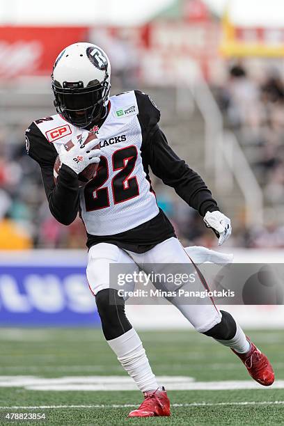 Brandon McDonald of the Ottawa Redblacks runs with the ball during the warmup prior to the CFL game against the Montreal Alouettes at Percival Molson...