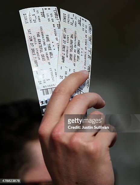 Man holds tickets to the Grateful Dead show at Levi's Stadium on June 27, 2015 in Santa Clara, California. The Grateful Dead is kicking off their...