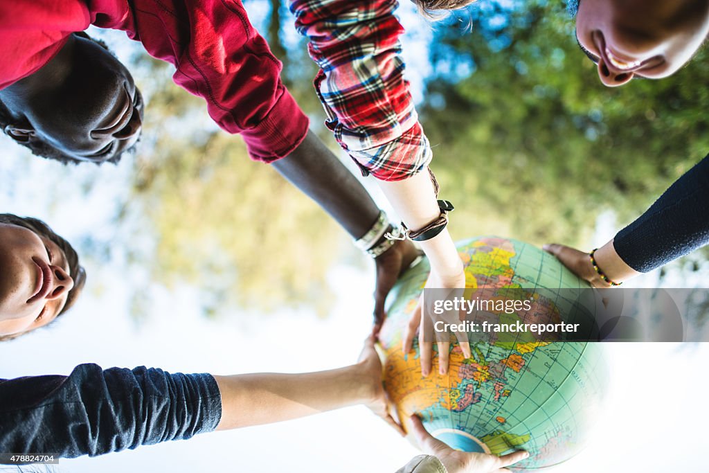 Teenagers college student smiling with globe