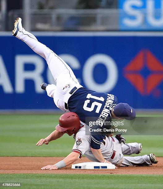 Cory Spangenberg of the San Diego Padres tangles with Nick Ahmed of the Arizona Diamondbacks as he turns a double play during the first inning of a...