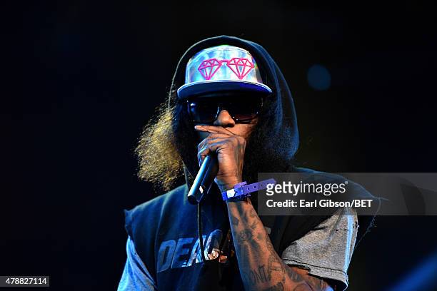 Hip-hop artist Ab-Soul performs onstage during the Ice Cube, Kendrick Lamar, Snoop Dogg, Schoolboy Q, Ab-Soul, Jay Rock concert at Staples Center on...