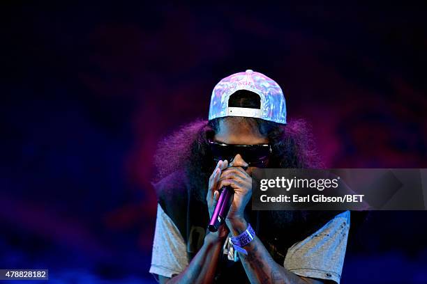 Hip-hop artist Ab-Soul performs onstage during the Ice Cube, Kendrick Lamar, Snoop Dogg, Schoolboy Q, Ab-Soul, Jay Rock concert at Staples Center on...