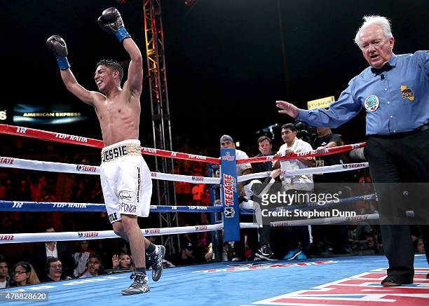 Jessie Vargas celebrates as he mistakenly thinks referee Pat Russell has stopped the fight on a knockout over Timothy Bradley Jr. In their Interim...
