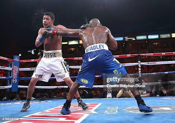 Timothy Bradley Jr. Lands a punch on Jessie Vargas in their Interim WBO World Title welterweight fight at StubHub Center on June 27, 2015 in Los...