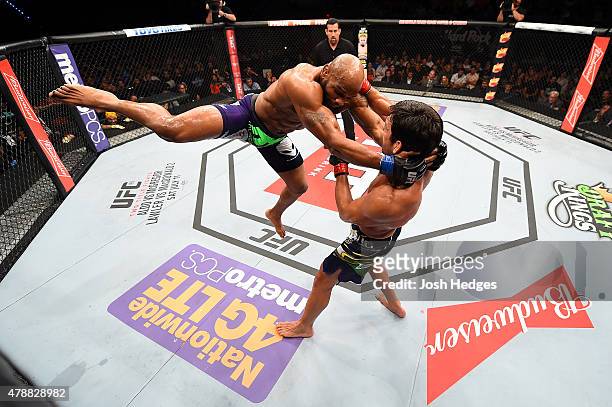 Yoel Romero of Cuba lunges at Lyoto Machida of Brazil in their middleweight during the UFC Fight Night event at the Hard Rock Live on June 27, 2015...