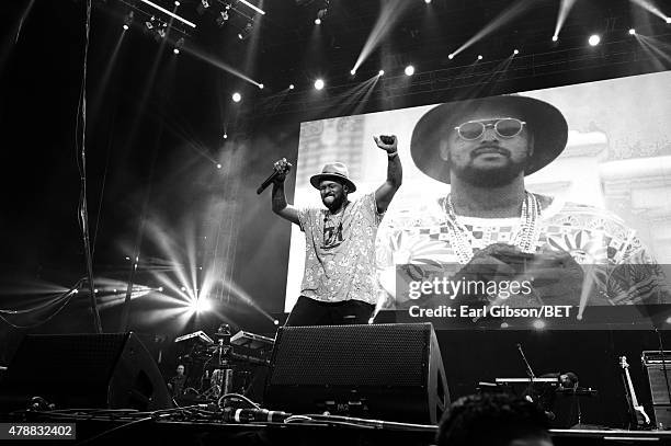 Hip hop artist Schoolboy Q performs onstage during the Ice Cube, Kendrick Lamar, Snoop Dogg, Schoolboy Q, Ab-Soul, Jay Rock concert at Staples Center...