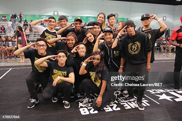 Dance troupe 'Brobots' pose at the dance competition sponsored by King.com during the 2015 BET Experience at the Los Angeles Convention Center on...