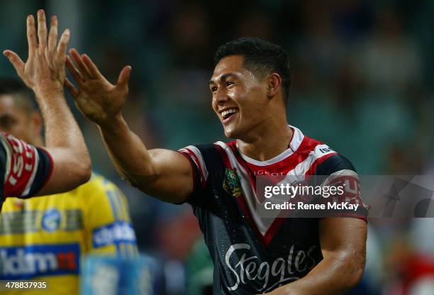 Roger Tuivasa Sheck of the Roosters celebrates his try during the round two NRL match between the Sydney Roosters and the Parramatta Eels at Allianz...