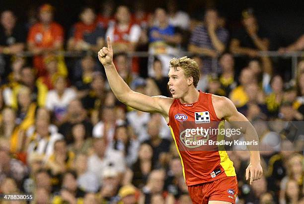 Tom Lynch of the Suns celebrates after kicking a goal during the round one AFL match between the Gold Coast Suns and the Richmond Tigers at Metricon...