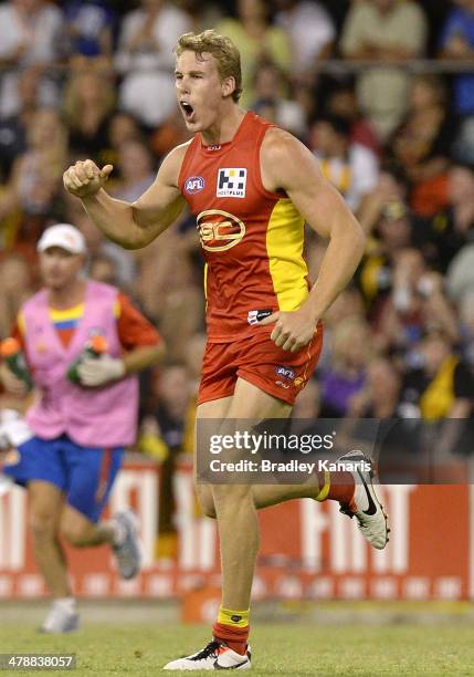 Tom Lynch of the Suns celebrates after kicking a goal during the round one AFL match between the Gold Coast Suns and the Richmond Tigers at Metricon...