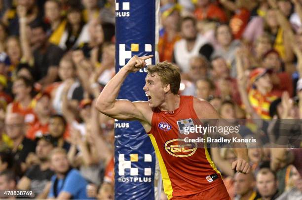 Tom Lynch of the Suns celebrates after kicking a goal during the round one AFL match between the Gold Coast Suns and the Richmond Tigers at Metricon...