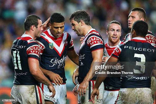 Daniel Tupou of the Roosters celebrates with team mates after scoring a try during the round two NRL match between the Sydney Roosters and the...