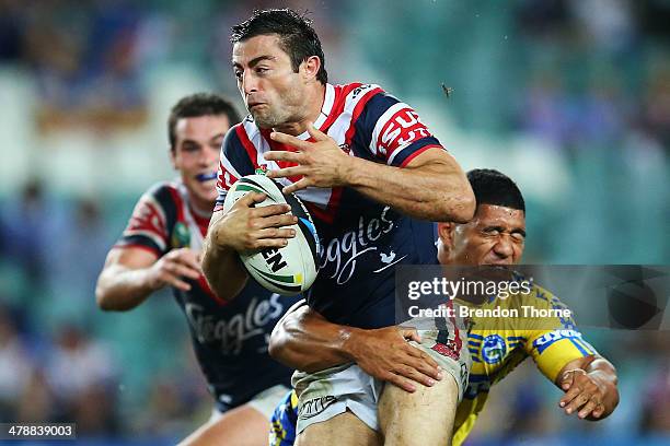 Anthony Minichello of the Roosters breaks the Eels defence during the round two NRL match between the Sydney Roosters and the Parramatta Eels at...