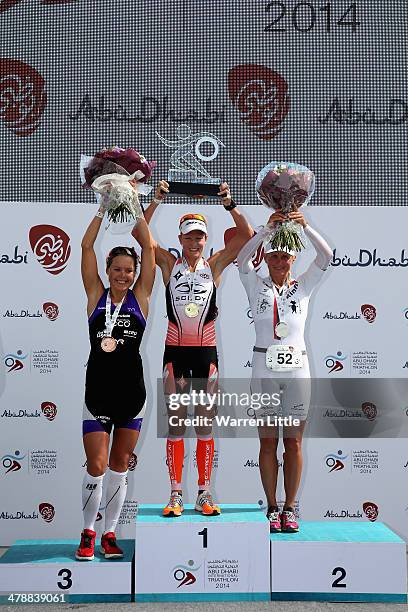 Lisa Marangon of Australia, Svenja Bazlen of Germany and Annabel Luxford of Australia pose on the podium after the elite female long course during...