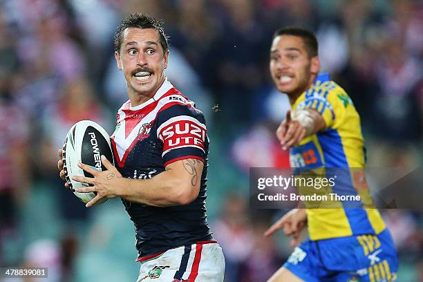 Mitchell Pearce of the Roosters runs the ball during the round two NRL match between the Sydney Roosters and the Parramatta Eels at Allianz Stadium...