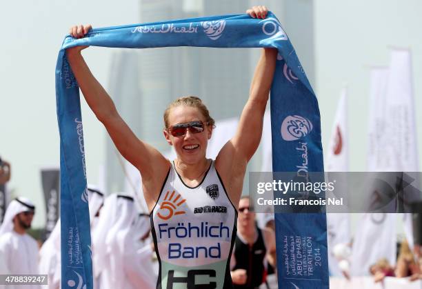 Svenja Bazlen of Germany celebrates after winning the elite female short course during the Abu Dhabi International Triathlon on March 15, 2014 in Abu...