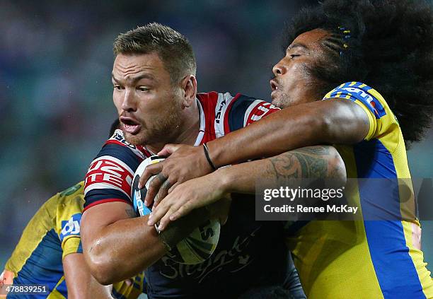 Jared Waerea Hargreaves is tackled by Fuifui Moimoi during the round two NRL match between the Sydney Roosters and the Parramatta Eels at Allianz...