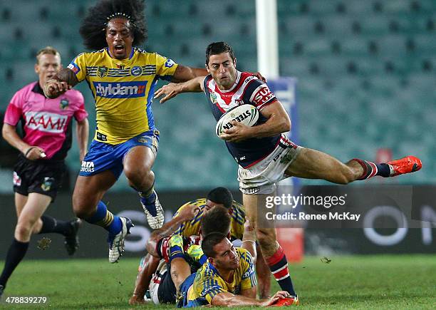 Anthony Minichiello makes a break for the Roosters during the round two NRL match between the Sydney Roosters and the Parramatta Eels at Allianz...