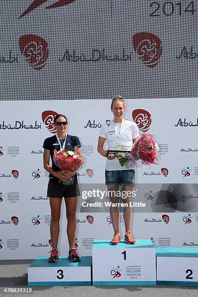 Lisa Marangon of Australia and Svenja Bazlen of Germany pose on the podium ater the elite female short course during the Abu Dhabi International...