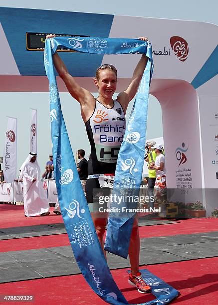 Svenja Bazlen of Germany celebrates after winning the elite female short course during the Abu Dhabi International Triathlon on March 15, 2104 in Abu...