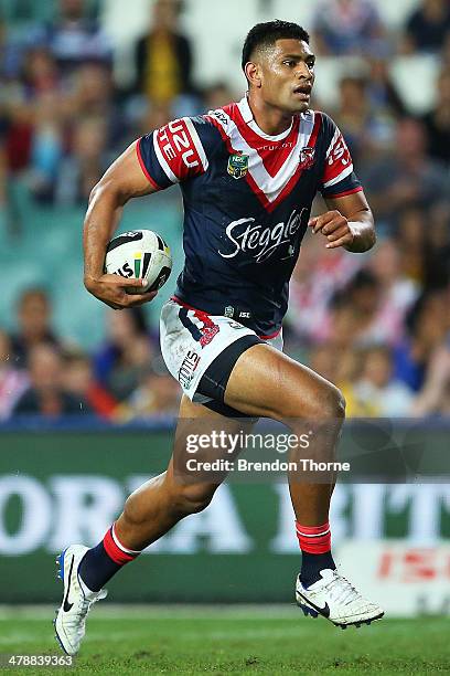 Daniel Tupou of the Roosters runs the ball during the round two NRL match between the Sydney Roosters and the Parramatta Eels at Allianz Stadium on...