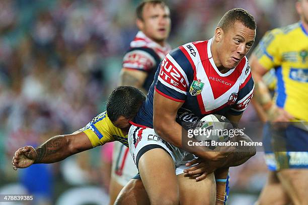 Kane Evans of the Roosters runs the ball during the round two NRL match between the Sydney Roosters and the Parramatta Eels at Allianz Stadium on...