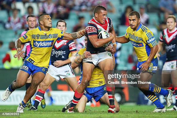 Kane Evans of the Roosters breaks the Eels defence during the round two NRL match between the Sydney Roosters and the Parramatta Eels at Allianz...