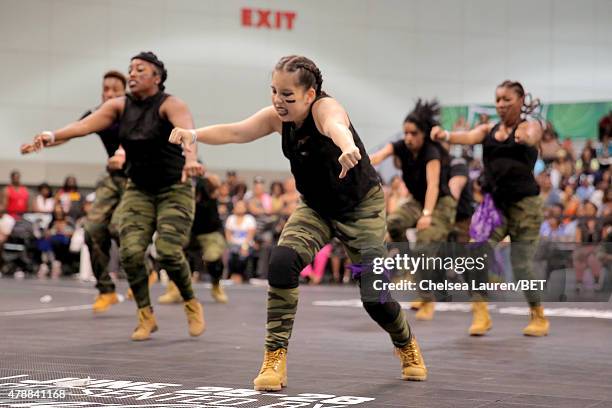 Dancers perform at the dance competition sponsored by King.com during the 2015 BET Experience at the Los Angeles Convention Center on June 27, 2015...