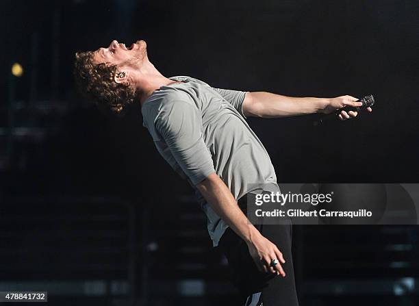 Musician Dan Reynolds of Imagine Dragons performs during Smoke + Mirrors Tour at Wells Fargo Center on June 27, 2015 in Philadelphia, Pennsylvania.