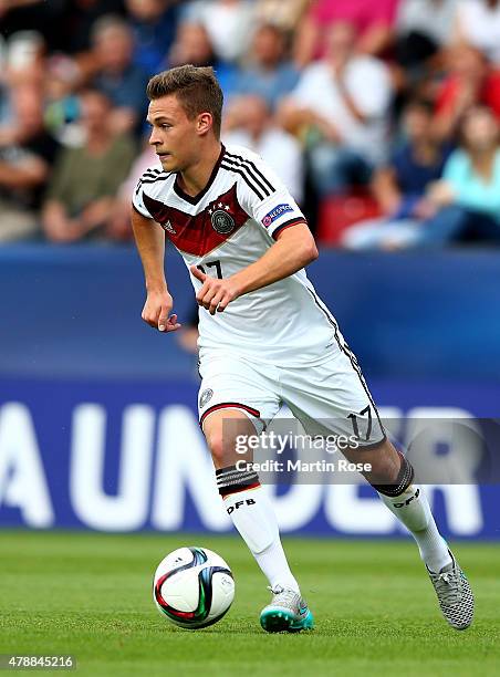 Joshua Kimmich of Germany runs with the ball during the UEFA European Under-21 semi final match Between Portugal and Germany at Ander Stadium on June...