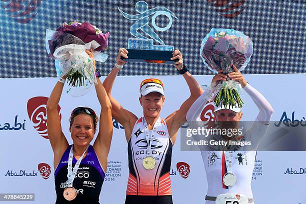 Lisa Marangon of Australia, Svenja Bazlen of Germany and Annabel Luxford of Australia pose on the podium after the elite female long course during...