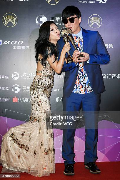 Singer Xiao Huang-Chi and singer Angie Lee pose with the trophies at backstage during 26th Golden Melody Awards at Taipei Arena on June 27, 2015 in...
