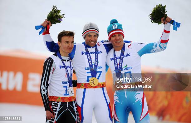Gold medalist Vincent Gauthier-Manuel of France celebrates with silver medalist Alexey Bugaev of Russia and bronze medalist Markus Salcher of Austria...