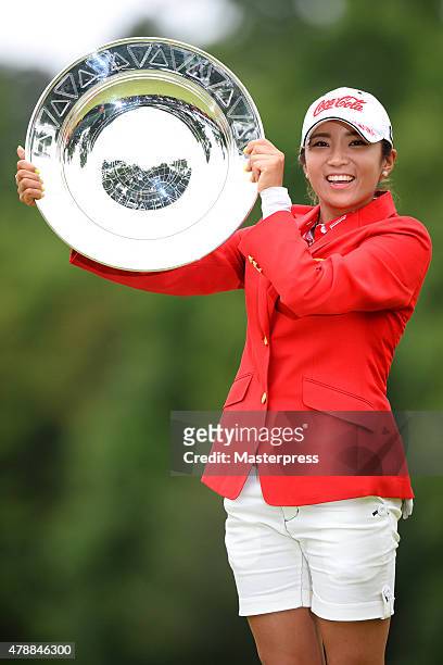 Bo-Mee Lee of South Korea poses with the trophy after winning the Earth Mondamin Cup at the Camellia Hills Country Club on June 28, 2015 in...