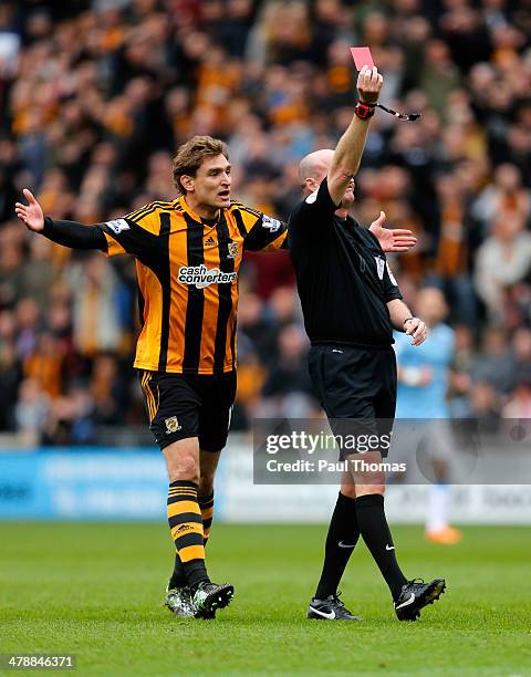 Nikica Jelavic of Hull City reacts as Referee Lee Mason shows the red card to Vincent Kompany of Manchester City during the Barclays Premier league...