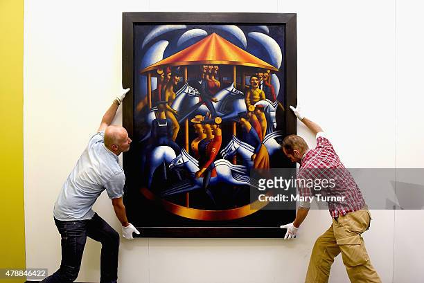 Mark Gertler's Merry-Go-Around is installed by gallery assistants as it returns to Ben Uri on loan for the first time since its sale to Tate in 1984....