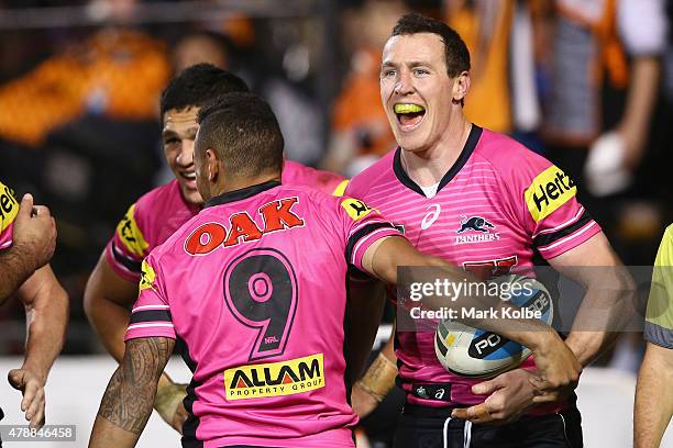 David Simmons of the Panthers celebrates scoring a try during the round 16 NRL match between the Wests Tigers and the Penrith Panthers at Leichhardt...