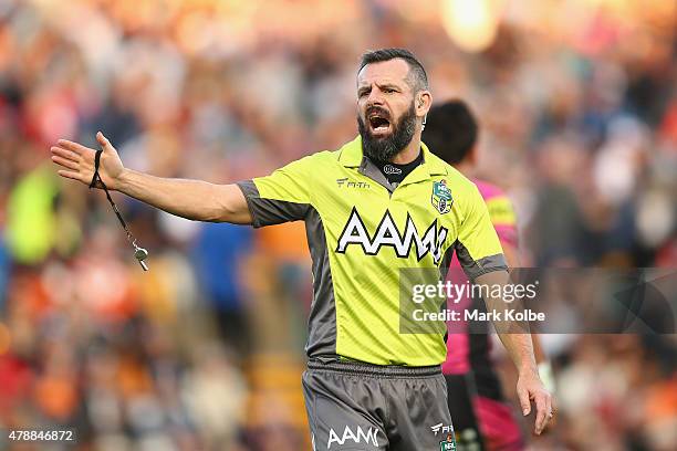 Referee Gavin Badger gives a penalty during the round 16 NRL match between the Wests Tigers and the Penrith Panthers at Leichhardt Oval on June 28,...