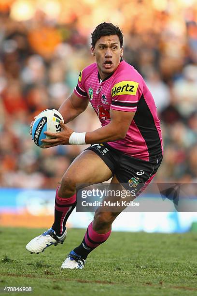Elijah Taylor of the Panthers runs the ball during the round 16 NRL match between the Wests Tigers and the Penrith Panthers at Leichhardt Oval on...