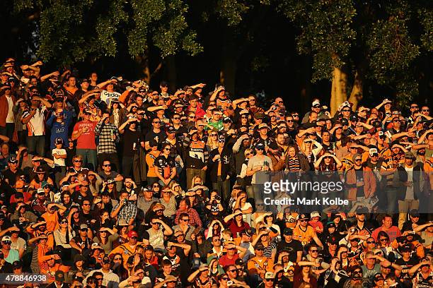 The crowd watch on during the round 16 NRL match between the Wests Tigers and the Penrith Panthers at Leichhardt Oval on June 28, 2015 in Sydney,...