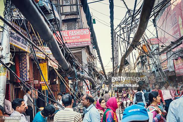 electric cables damage in the streets of old delhi - indian slums stock pictures, royalty-free photos & images