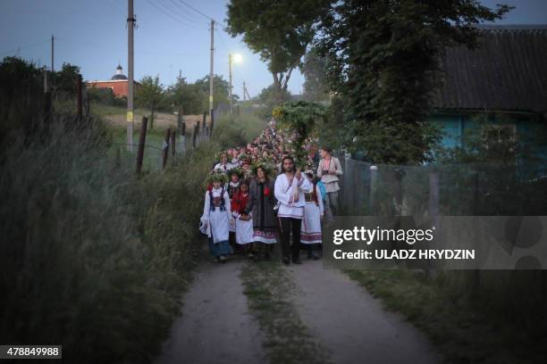 People dressed in traditional clothing celebrate Kupala Night in the Village of Rakau, some 30 km west of Minsk, on June 27, 2015. People celebrate...