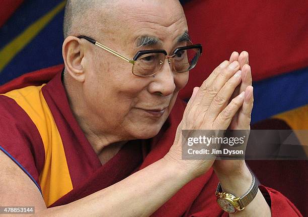 His holiness the Dalai Lama arrives to give a talk during the third day of Glastonbury Festival at Worthy Farm, Pilton on June 28, 2015 in...