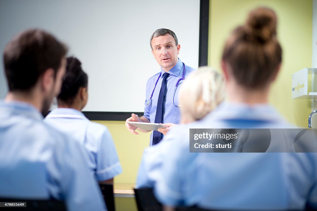 Doctor briefing nursing students