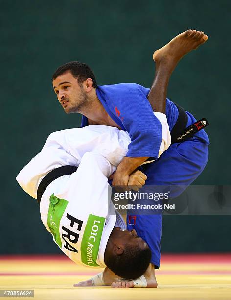 Loic Karval of France and Amiran Papinashvili of Georgia compete in the Men's Team gold match during day sixteen of the Baku 2015 European Games at...