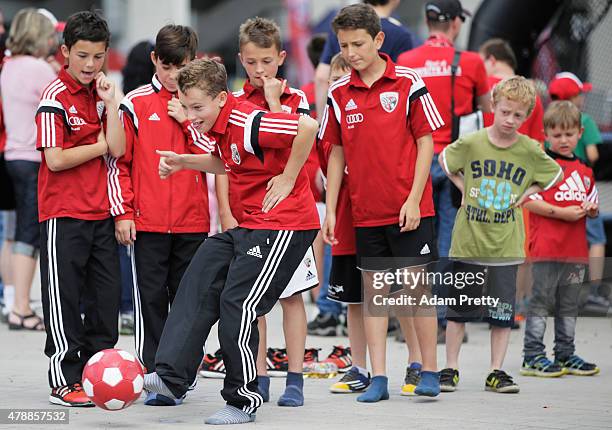 Young FC Ingolstadt fans enjoy the activities on the first day of training at Audi Sportpark on June 28, 2015 in Ingolstadt, Germany.