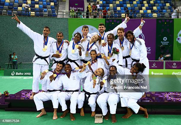 Gold medalists France pose with the medals won in the Men's and Women's Team finals during day sixteen of the Baku 2015 European Games at Heydar...