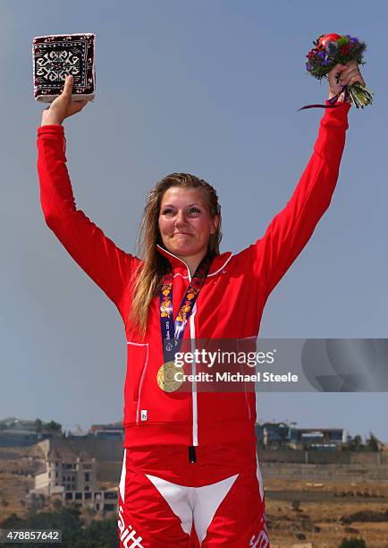 Gold medalist Simone Christensen of Denmark celebrates on the medal podium following the Women's Cycling BMX Final during day sixteen of the Baku...